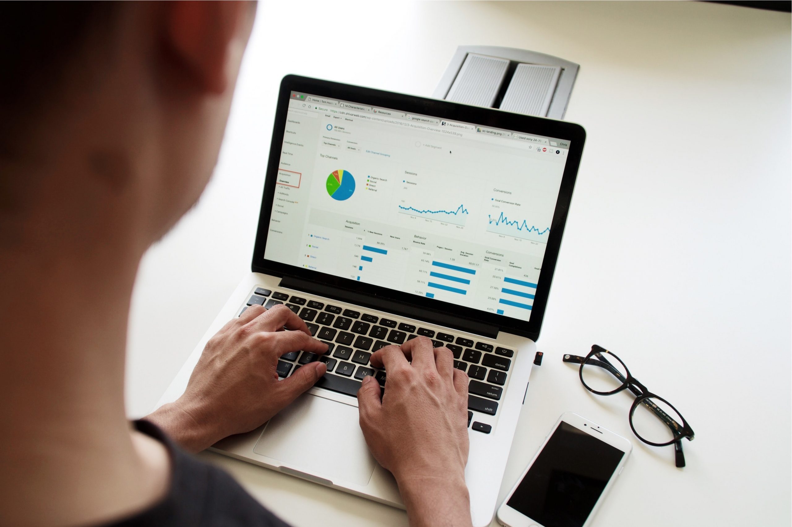 DfT Analyst analysing a graph on their laptop