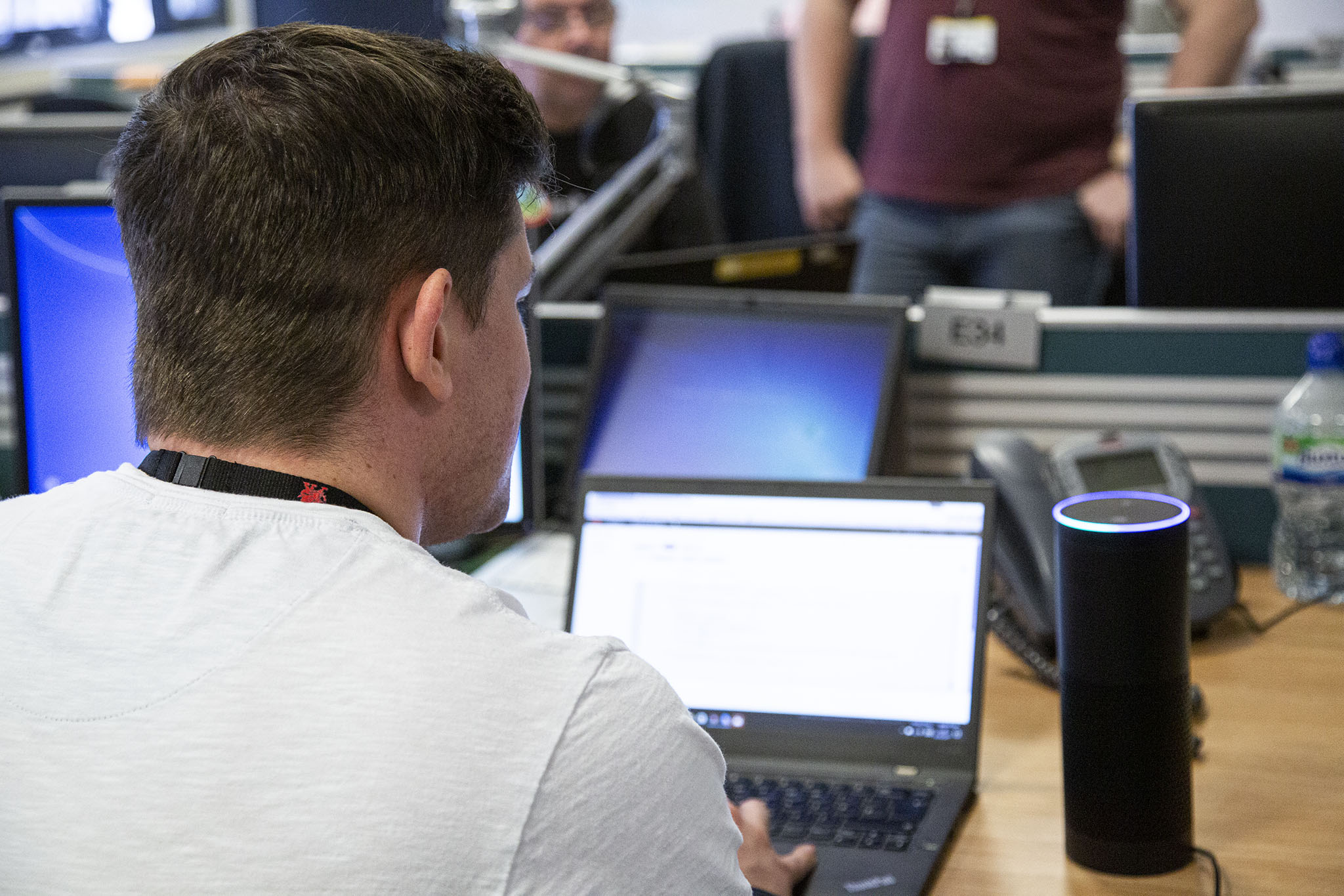 Male DfT Digital professional using a laptop.