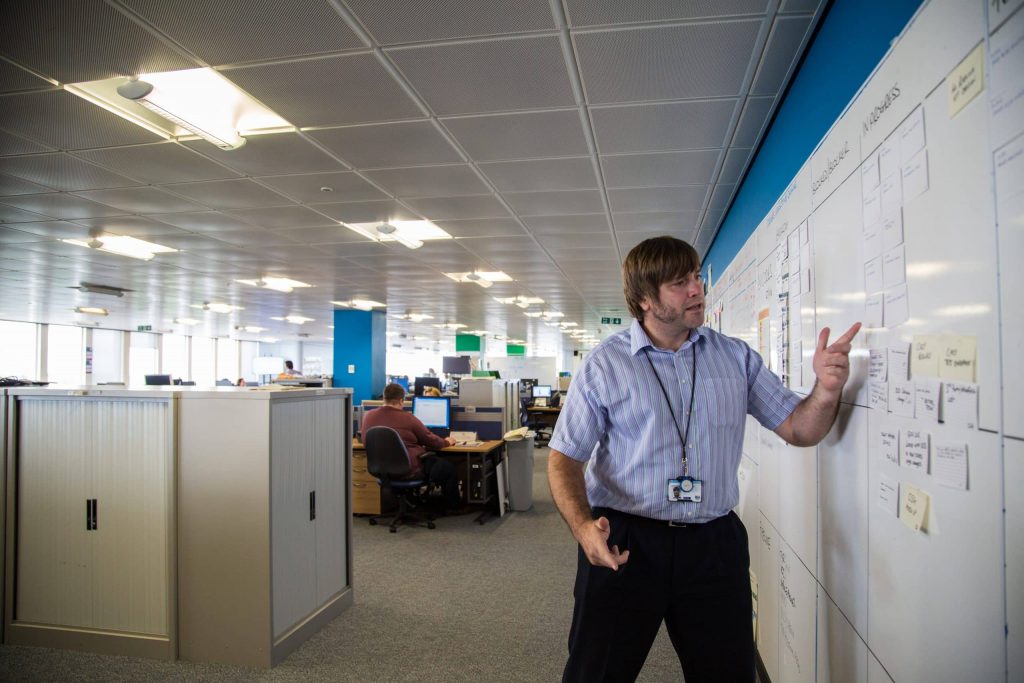 DfT Project Delivery professional presenting to colleagues.