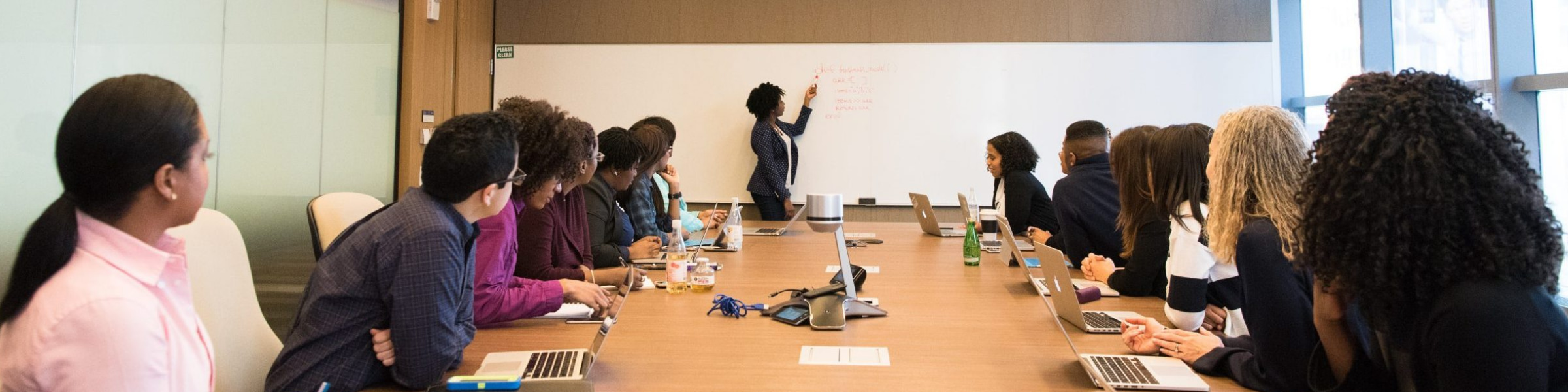 DfT staff member presenting to a boardroom of staff.