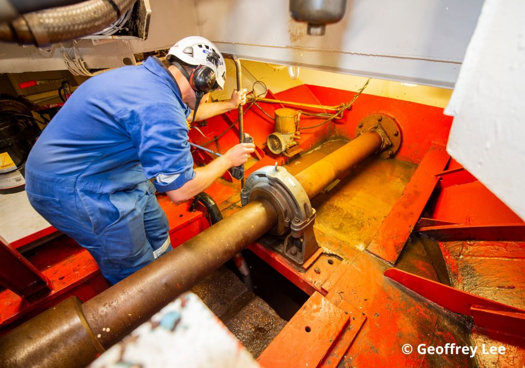 MCA engineer repairing a boat to be used by the Coastguard.